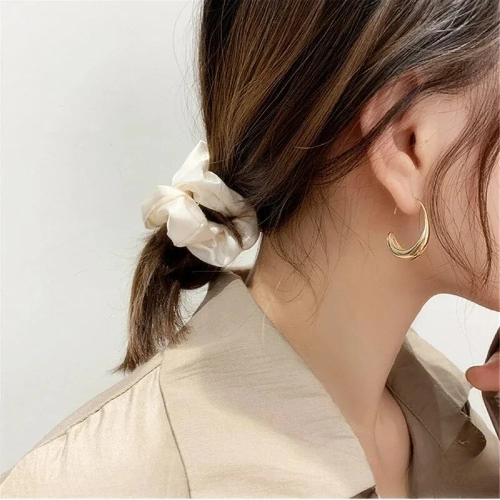 Elegant Earrings Made of Gold and Silver