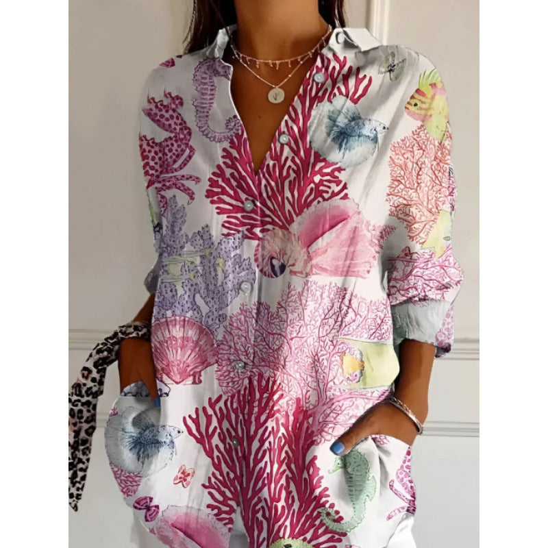Coralina - Long-sleeved blouse with vibrant blue print