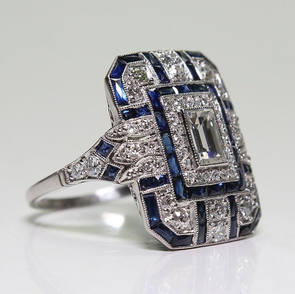 Vintage silver ring with shiny finish and blue zircon